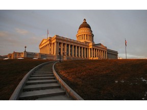 FILE - In this March 8, 2018, file photo, the sunsets on the Utah State Capitol, in Salt Lake City. After months of fierce debate and campaigning, Mormon church leaders, state lawmakers and the governor all opponents of the initiative reached a compromise with medical marijuana advocates in which they agreed on parameters for a law that suited all sides.