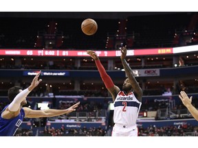 Washington Wizards guard John Wall (2) shoots against Los Angeles Clippers forward Danilo Gallinari, left, during the second half of an NBA basketball game, Tuesday, Nov. 20, 2018, in Washington. The Wizards won 125-118.