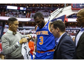 New York Knicks guard Tim Hardaway Jr. (3) is helped off court after falling during the first half of an NBA basketball game against the Washington Wizards, Sunday, Nov. 4, 2018, in Washington.