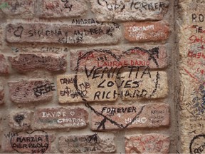 Romantic inscriptions are traditional markings on the walls of the courtyard of casa di Giulietta in Verona, Italy. However, few facts support the claim of this being the home of Juliet of Shakespeare fame.