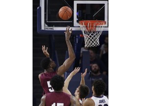 Texas Southern center Trayvon Reed (5) shoots while defended by Gonzaga forward Filip Petrusev during the first half of an NCAA college basketball game in Spokane, Wash., Saturday, Nov. 10, 2018.