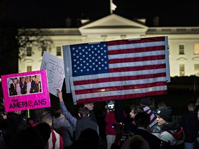 Protesters gather in front of the White House in Washington on Nov. 8, 2018, as part of a nationwide "Protect Mueller" campaign demanding that Acting U.S. Attorney General Matthew Whitaker recuse himself from overseeing the special counsel investigation into Russian interference in the presidential election.
