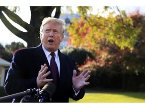 President Donald Trump speaks to the media before leaving the White House in Washington, Tuesday, Nov. 20, 2018, to travel to Florida.