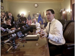 Addressing members of the media for the first time after failing to win re-election in the 2018 race, Wisconsin Governor Scott Walker addresses members of the media from his office in Madison, Wis., Thursday, Nov. 15, 2018.