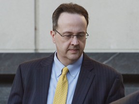 FILE - In this Tuesday, Oct. 2, 2018 file photo, West Virginia Supreme Court Justice Allen Loughry leaves the Robert C. Byrd United States Courthouse in Charleston, W.Va. after a federal jury was selected for his criminal trial. On Saturday, Nov. 10, 2018, the office of Gov. Jim Justice said that he has accepted the resignation of the suspended state Supreme Court justice recently convicted of federal charges, days ahead of a legislative session set to consider the justice's removal amid an ongoing scandal involving the court.