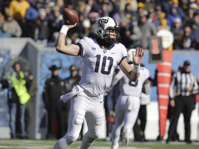 TCU quarterback Michael Collins (10) attempts a pass during the first half of an NCAA college football game against West Virginia, Saturday, Nov. 10, 2018, in Morgantown, W.Va.