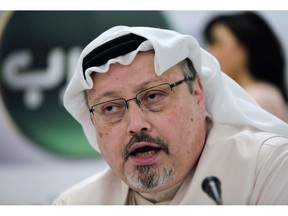 Saudi journalist Jamal Khashoggi speaks during a press conference in Manama, Bahrain, in 2014.