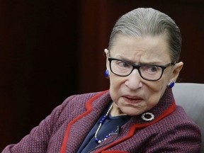 In this Jan. 30, 2018 photo, Supreme Court Justice Ruth Bader Ginsburg participates in a "fireside chat" in the Bruce M. Selya Appellate Courtroom at the Roger William University Law School in Bristol, R.I. Ginsburg is missing a brief court session while she recovers from a fall and three broken ribs. A Supreme Court spokeswoman says the 85-year-old justice "continues to improve" but is not joining her colleagues Tuesday morning when the court takes the bench briefly for routine business. The Supreme Court's oldest justice fell in her office at the court last Wednesday, went to a Washington hospital on Thursday and was released from the hospital on Friday.