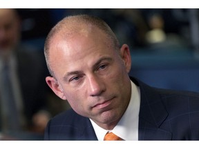 FILE - In this May 10, 2018 file photo, Michael Avenatti is interviewed in New York. A woman who says she had a relationship with Michael Avenatti alleges he dragged her by the arm across the floor of his Los Angeles apartment after an argument. Court papers obtained Tuesday by The Associated Press detail actress Mareli Miniutti's account. Avenatti hasn't addressed the specifics of the allegations but says he'll be fully exonerated after a thorough investigation.
