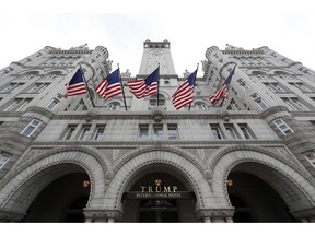 FILE - In this Dec. 21, 2016, file photo, the Trump International Hotel at 1100 Pennsylvania Avenue NW, is seen in Washington. Justice Department's lawyers appeared to be challenging a Maryland federal judge's decision to allow a case against President Donald Trump to move forward. The Nov. 30, 2018, filing, however, was merely a notice to the court. It comes as U.S. District Court Judge Peter J. Messitte is poised to allow the subpoenas to begin flowing on Monday. Such information would likely provide the first clear picture of Trump's Washington, D.C. hotel's finances.