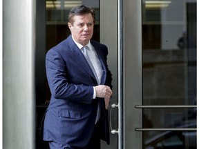FILE - In this Feb. 14, 2018 file photo, Paul Manafort, President Donald Trump's former campaign chairman, leaves the federal courthouse in Washington. Manafort says in a statement that a Guardian report saying he met with Assange at the Ecuadorian embassy is "totally false and deliberately libelous." Manafort says that he has never been contacted by "anyone connected to WikiLeaks, either directly or indirectly."