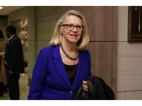 FILE - In this Nov. 15, 2018, fie photo, Rep.-elect Carol Miller, R-W.Va., walks to a session during member-elect briefings and orientation on Capitol Hill in Washington. or House Republicans, this month's elections ushered in the year of the woman _ literally. Miller will be the only GOP woman entering the chamber as a newcomer in January, and there may be as few as 13 House GOP women overall..