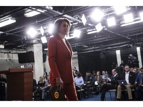 In this Nov. 15, 2018, photo, House Minority Leader Nancy Pelosi, D-Calif., leaves a news conference at the Capitol in Washington. Pelosi's bid to return as House speaker is putting newly elected Democrats in a spot. The speaker's vote will among the first votes cast in the new Congress, with all eyes will be watching -- and cameras rolling for TV ads -- to see if the incoming freshmen who promised to oppose Pelosi on the campaign trail will actually do so in the House chamber.