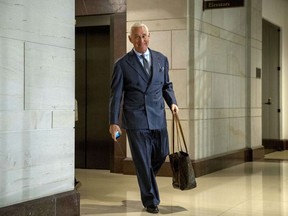 FILE - In this Sept. 26, 2017, file photo, longtime Donald Trump associate Roger Stone arrives to testify before the House Intelligence Committee, on Capitol Hill in Washington. An associate of Stone said Monday, Nov. 12, 2018, that he expects to face charges in the special counsel's Russia investigation. Conservative conspiracy theorist Jerome Corsi said on his YouTube show that negotiations fell apart with special counsel Robert Mueller's team and he expects in the coming days to be charged with making false statements.