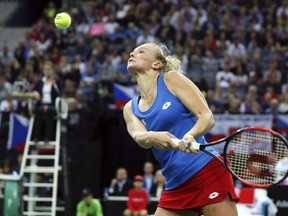 Katerina Siniakova of the Czech Republic returns with a backhand to Sofia Kenin of the United States during their tennis match of the Fed Cup Final between Czech Republic and United States in Prague, Czech Republic, Sunday, Nov. 11, 2018.