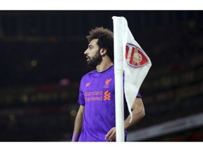 Liverpool's Mohamed Salah walks near the corner flag during the English Premier League soccer match between Arsenal and Liverpool at Emirates stadium in London, England, Saturday, Nov. 3, 2018.