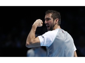 Marin Cilic of Croatia reacts after winning the second set during his ATP World Tour Finals men's singles tennis match against John Isner of the United States at the O2 arena in London, Wednesday, Nov. 14, 2018.