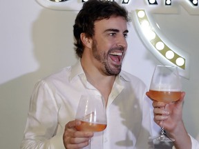 McLaren driver Fernando Alonso, of Spain, makes a toast during a promotion event made by one of his sponsors, in Sao Paulo, Brazil, Wednesday, Nov. 7, 2018. Alonso will compete Sunday in the Brazilian Formula One Grand Prix at Sao Paulo's Interlagos circuit.