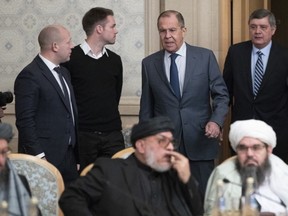Russian Foreign Minister Sergey Lavrov, second right, arrives to attend a conference on Afghanistan bringing together representatives of the Afghan authorities and the Taliban in Moscow, Russia, Friday, Nov. 9, 2018. The conference marks Moscow's attempt to get the Afghan authorities and the Taliban together at a table. The U.S. Embassy in Moscow has sent a diplomat to observe the discussions.