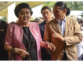 Former Philippine First Lady Imelda Marcos arrives at an anti-graft court Sandiganbayan to explain her side for not attending last week's promulgation of the graft charges against her Friday, Nov. 16, 2018 in suburban Quezon city northeast of Manila, Philippines. A Philippine court found Imelda Marcos guilty of graft and ordered her arrest last week in a rare conviction among many corruption cases that she's likely to appeal to avoid jail and losing her seat in Congress.