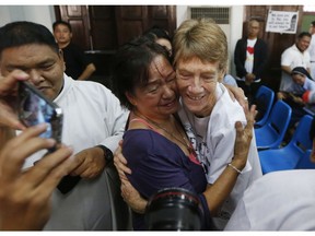 Australian Roman Catholic nun Sister Patricia Fox is hugged by a supporter following a news conference hours before her departure for Australia Saturday, Nov. 3, 2018, in Manila, Philippines. Sister Fox decided to leave after 27 years in the country after the Immigration Bureau denied her application for the extension of her visa. The Philippine immigration bureau has ordered the deportation of Fox who has angered the president by joining anti-government rallies.