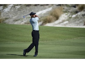 Tiger Woods hits from the fairway at the third hole during the first round of the Hero World Challenge at the Albany Golf Club in Nassau, Bahamas, Thursday, Nov. 29, 2018. Woods now is No. 13 in the world as he hosts this holiday tournament for the 20th time.