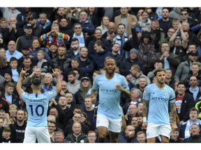 Manchester City's Sergio Aguero, left, celebrates after scoring his side's second goal during the English Premier League soccer match between Manchester City and Southampton at Etihad stadium in Manchester, England, Sunday, Nov. 4, 2018.