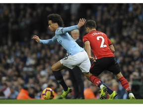 Manchester City's Leroy Sane, left, duels for the ball with Southampton's Cedric Soares during the English Premier League soccer match between Manchester City and Southampton at Etihad stadium in Manchester, England, Sunday, Nov. 4, 2018.