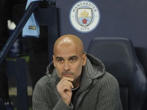 Manchester City coach Pep Guardiola looks on before the Champions League Group F soccer match between Manchester City and Shakhtar Donetsk at Etihad stadium in Manchester, England, Wednesday, Nov. 7, 2018.