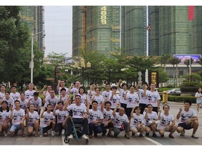 In this photo provided by the Jasic Workers Support Group and taken Aug 2018, members of the Jasic Workers Support Group pose for a group photo after a campaign promoting worker's rights in Dezhou city in Guangdong province. Students and alumni of several Chinese universities are sounding the alarm over the apparent detention of more than a dozen young labor activists including Zhang Shengye, a recent graduate of Peking University, seen at the right standing row, who have been missing since the weekend. (Jasic Workers Support Group via AP)