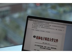 In this photo taken Thursday, Nov. 15, 2018, a computer screen shows the leaked online post from Guilin University of Electronic Technology warning of "hostile domestic and foreign powers" that were "wantonly spreading illicit and illegal videos" through the internet in Beijing, China. The Chinese university's plan to conduct a blanket search of student and staff electronic devices has come under fire, illustrating the limits of the population's tolerance for surveillance and raising concern that tactics used on China's Muslim minorities may be creeping into the rest of the country.