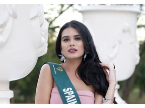 In this Oct. 25, 2018 photo, Venezuelan born Carolina Jane, representing Spain in the Miss Earth 2018 beauty pageant, poses prior to a pre-judging event in the Miss Earth 2018 Beauty pageant at the Versailles resort in Alabang, south of Manila, Philippines. As thousands of people leave Venezuela each day to escape food shortages and an inflation rate that is expected to surpass 1 million percent, dozens of would-be beauty queens are also taking flight and finding work as models and media personalities overseas. Some are even representing their adopted homelands in international beauty pageants.