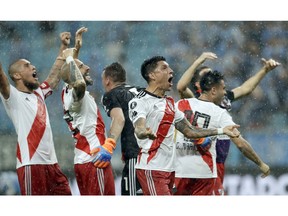 In this Oct. 31, 2018 photo photo, Argentina's River Plate players celebrate after defeating Brazil's Gremio during a semifinal second leg match of the Copa Libertadores in Porto Alegre, Brazil. River advances to the finals. River will face its longtime rival Boca Juniors in the final.