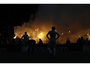 CSKA Moscow supporters light flares during a Group G Champions League soccer match between CSKA Moscow and Roma at the Luzhniki Stadium in Moscow, Wednesday, Nov. 7, 2018.