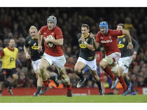 Wales Jonathan Davies makes a break during the rugby union international match between Wales and South Africa at the Principality Stadium in Cardiff, Wales, Saturday, Nov. 24, 2018.