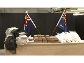 This image made from video shows a cocaine seizure at a police press conference in Auckland, New Zealand Friday, Nov. 16, 2018.  New Zealand police have made the country's largest cocaine seizure, with 190 kilograms (418 pounds) of the drug found in a container of bananas shipped from Panama. New Zealand police and customs officials say the cocaine was contained in five duffel bags on top of bananas in a shipment that arrived in Auckland from Balboa, Panama, in August. Police say a 41-year-old man has been arrested in Sydney after a joint operation with Australia's Federal Police and its Criminal Intelligence Commission. (NZ Herald via AP)