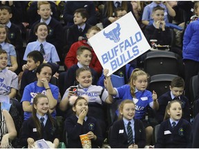 Belfast school children watch the NCAA college basketball game between the Buffalo Bulls and the Milwaukee Panthers, Friday, Nov. 30, 2018, in Belfast.