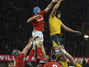 Australia's Adam Coleman, right, taps the ball ahead of Wales Justin Tipuric during the rugby union international match between Wales and Australia at the Principality Stadium in Cardiff, Wales, Saturday, Nov. 10, 2018.