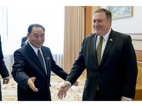 FILE - In this July 7, 2018 file photo, U.S. Secretary of State Mike Pompeo, right, and Kim Yong Chol, a North Korean senior ruling party official and former intelligence chief, arrive for a lunch at the Park Hwa Guest House in Pyongyang, North Korea. Kim Yong Chol, a senior North Korean envoy's meeting with U.S. Secretary of State Pompeo has been delayed, throwing already deadlocked diplomacy over the North's nuclear weapons into further uncertainty.
