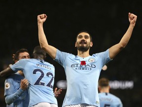 Manchester City's Ilkay Gundogan celebrates after scoring his side's third goal during the English Premier League soccer match between Manchester City and Manchester United at the Etihad stadium in Manchester, England, Sunday, Nov. 11, 2018.