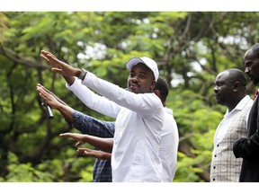 Opposition leader Nelson Chamisa greets the crowd during a demonstration in Harare, Thursday, Nov. 29, 2018. Zimbabweans are gathering for a nationwide protest over the country's economic collapse and what the opposition calls the new government's "cocktail of lies."