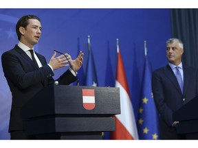 Austrian Chancellor Sebastian Kurz, left, gestures during a joint press conference with Kosovo President Hashim Thaci in Pristina, Kosovo, Tuesday, Nov. 6, 2018. The Austrian Chancellor told Kosovo that dialogue with Serbia is the basis for any further step toward the European Union. Kurz, whose country currently holds the European Union's rotating presidency, said in his visit to Pristina that without a peaceful Pristina-Belgrade agreement there would be no peaceful coexistence and regional stability.