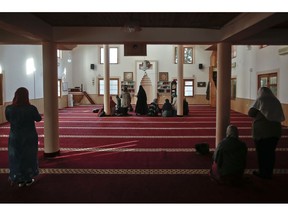 Muslim women pray before they attend a class inside the Haxhi Veseli mosque in the northern Kosovo town of Mitrovica on Monday, Nov. 12, 2018. In Kosovo, the move to establish the religious training of women as spiritual teachers and theologians in mosques, is seen by some as a way to make Kosovo's approach to Islam more gender-balanced.