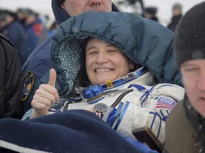 Serena Auñón-Chancellor of NASA is carried to a medical tent shortly after she, Alexander Gerst of ESA (European Space Agency), and Sergey Prokopyev of Roscosmos landed in their Soyuz MS-09 spacecraft in Zhezkazgan, Kazakhstan.