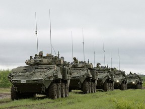 General Dynamics Land Systems Canada Lav 6 vehicles like the ones being sold to Saudi Arabia are shown carrying troops.