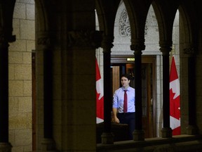 Prime Minister Justin Trudeau makes his way from his office to take part in a year end interview with The Canadian Press on Parliament Hill in Ottawa on Friday, Dec. 14, 2018.