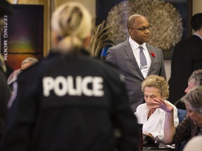 In this Oct. 26, 2016 file photo, Justice Michael Tulloch (right) is shown during a public consultation event in Ottawa.