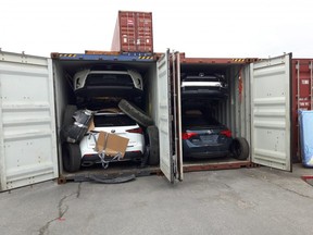 Stolen vehicles are found by investigators inside shipping containers in Montreal in 2018.