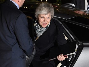 Britain's Prime Minister Theresa May arrives at 10 Downing Street in central London as she waits for the result of a confidence vote by her Conservative party on December 12, 2018.