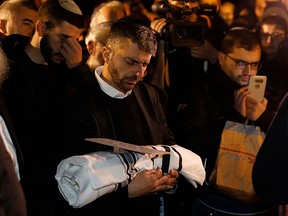 Relatives of Amichai and Shira Ish-Ran attend the funeral of their baby Amiad at the Jewish cemetery on the Mount of Olives in front of the Jerusalem's Old City on Dec. 12, 2018. The baby's pregnant mother, Shira, was one of seven people wounded in a drive-by shooting at a bus stop near the Ofra settlement in the occupied West Bank on Dec. 9.